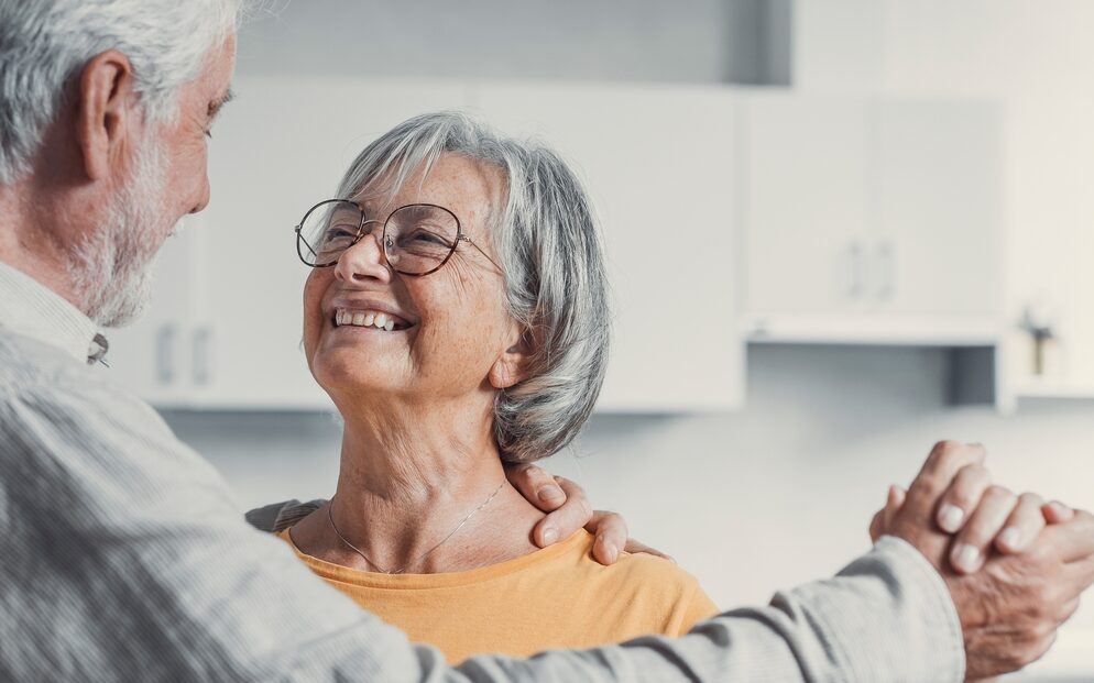 Joyful,Active,Old,Retired,Romantic,Couple,Dancing,Laughing,In,Living