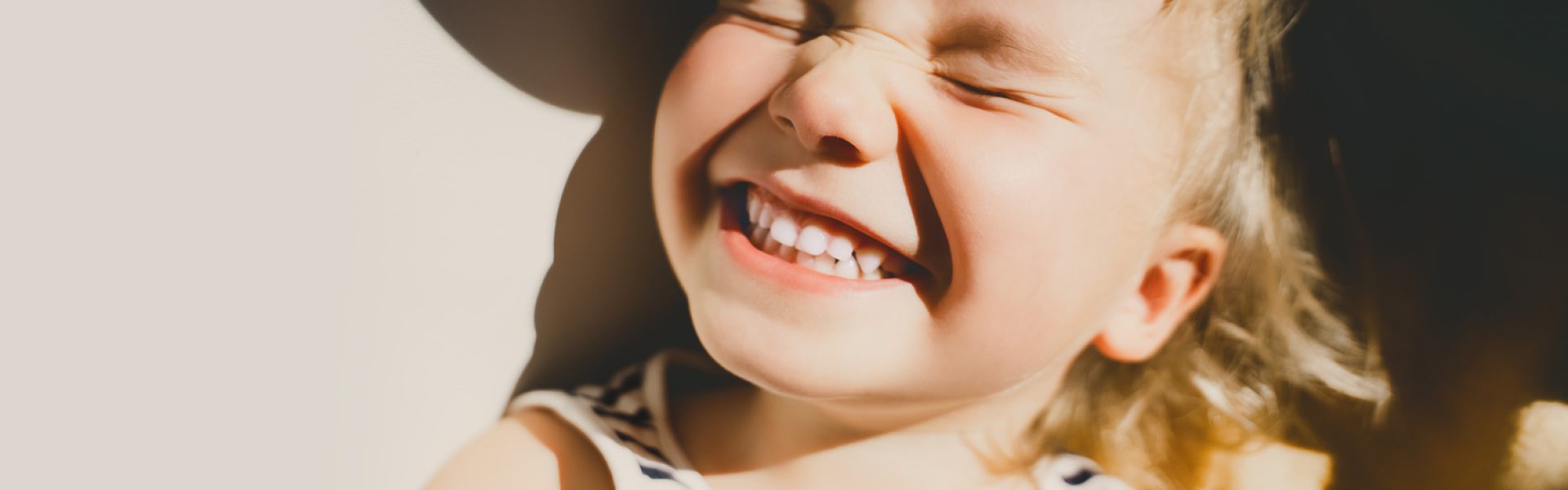 Cutest,Little,Girl,Smiling,And,Squinting,In,Sunlight.,Happy,Toddler