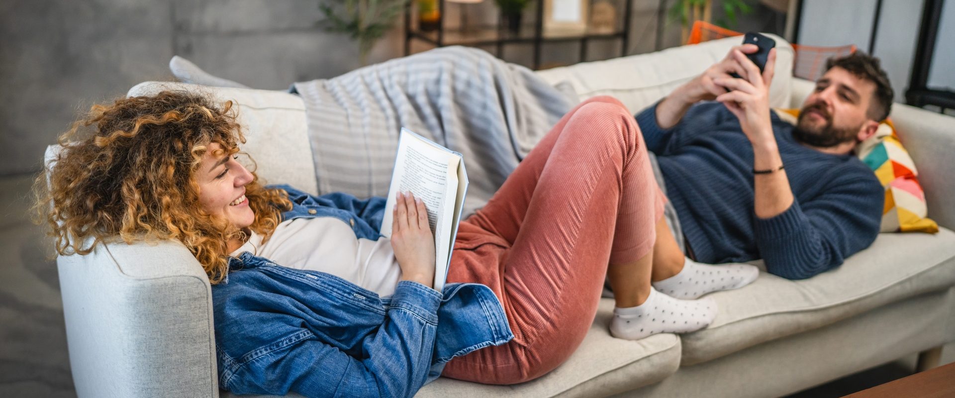 Girlfriend,Read,A,Book,And,Lying,Down,On,Sofa,With