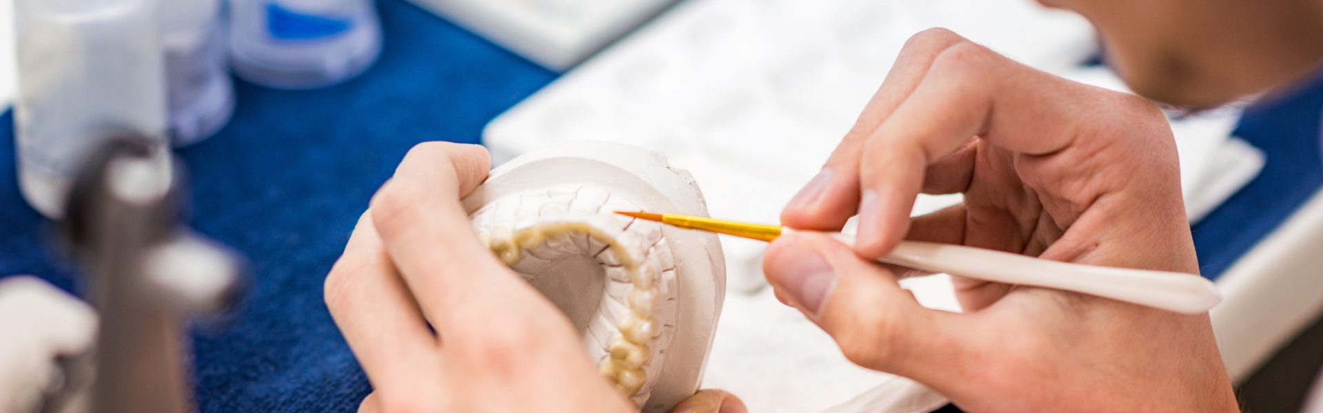 Dental,Technician,Or,Dentist,Working,With,Tooth,Dentures,In,His